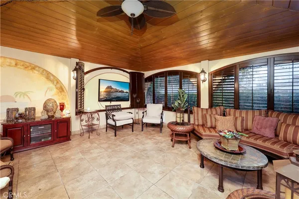 an aerial view of a house with a swimming pool outdoor seating yard and outdoor seating