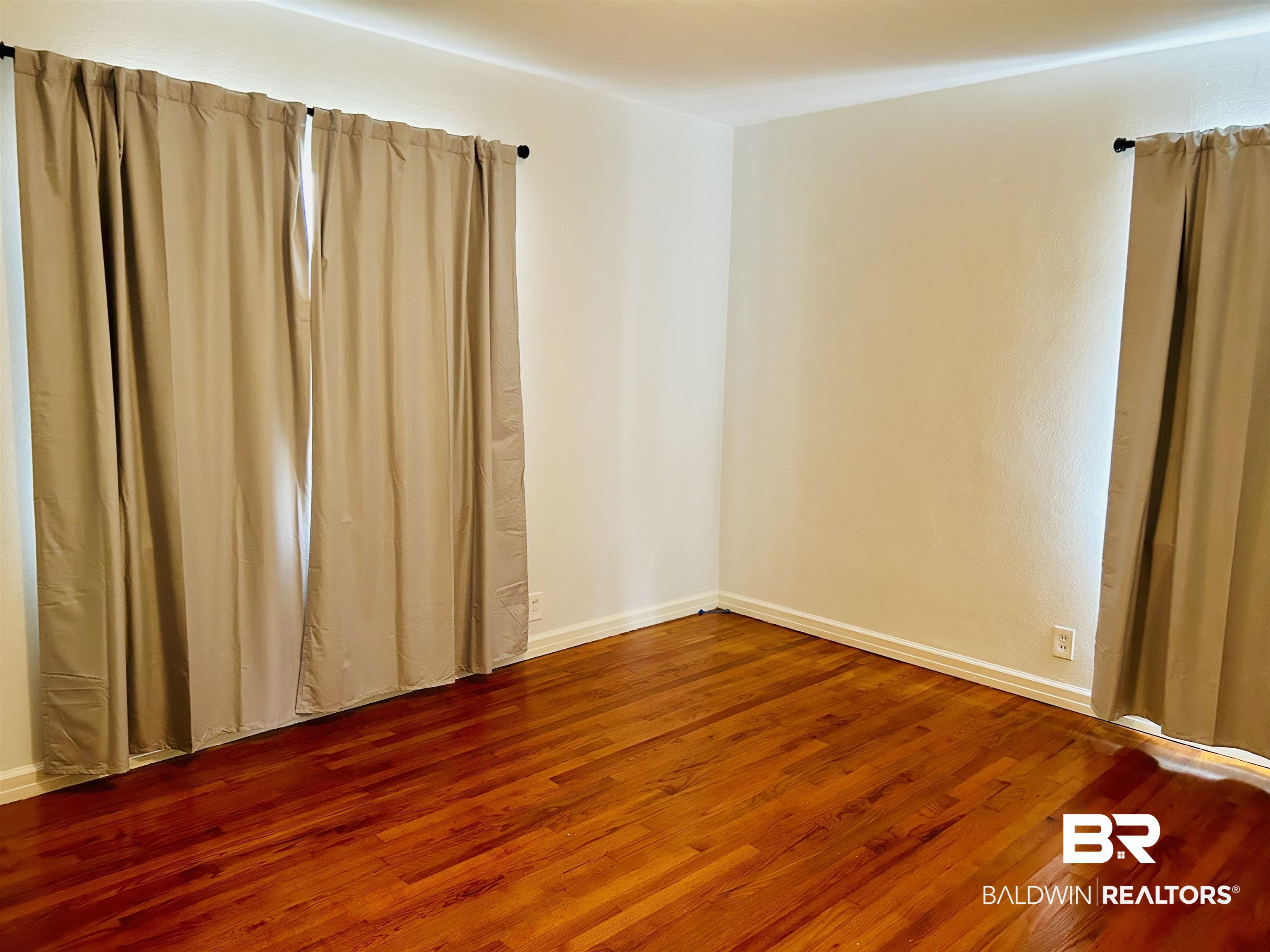 94 Diamond Street Mobile, AL 36611 - Photo 6 of 30 Empty room with hardwood / wood-style floors