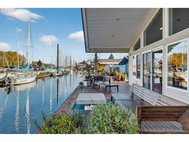 a living room with lots of furniture and white walls