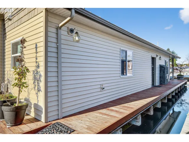 a view of a patio with wooden floor and furniture