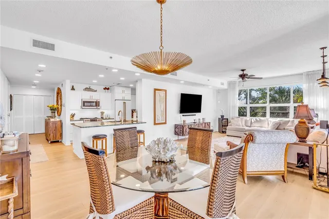 a dining room with furniture a window and kitchen view