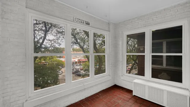 a view of front door and wooden floor