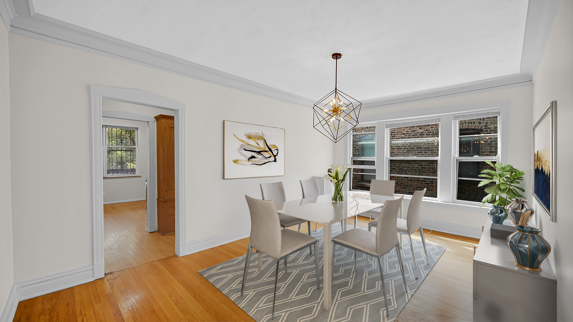 1213 East 53rd Street, Unit 3W Chicago, IL 60615 - Photo 4 of 21 a view of a dining room with furniture window and wooden floor