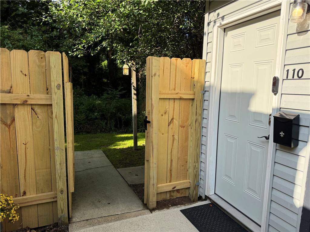 125 Maple Street, Unit 110 Pendleton, SC 29670 - Photo 2 of 18 A private entry welcomes you through a new wooden gate to this inviting home.