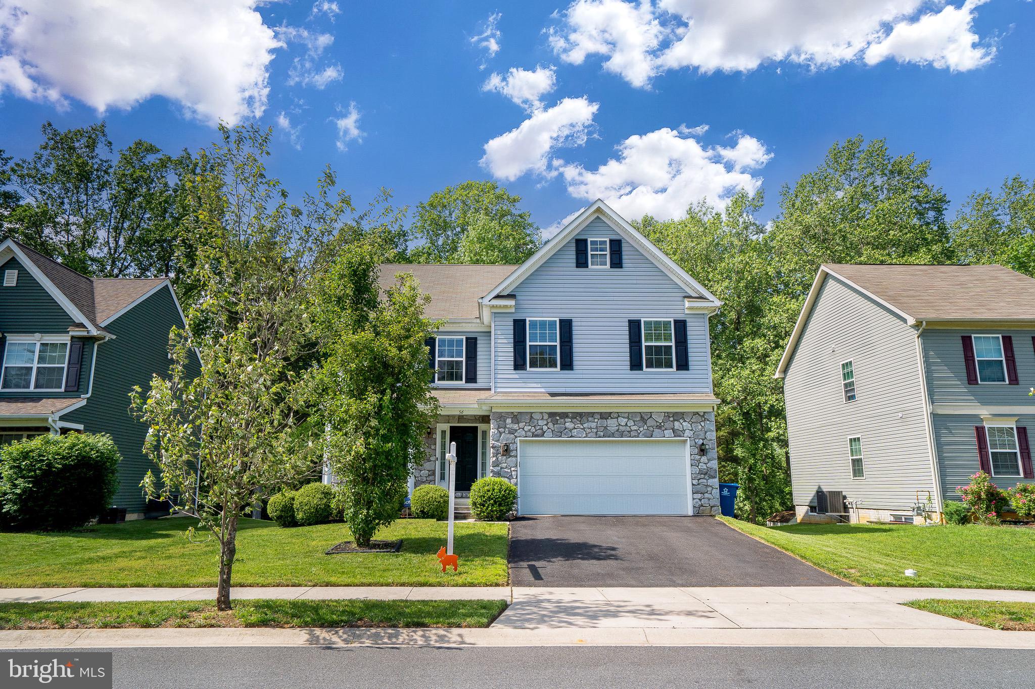 56 Thyme Street Elkton, MD 21921 - Photo 1 of 1 a front view of a house with a yard and garage