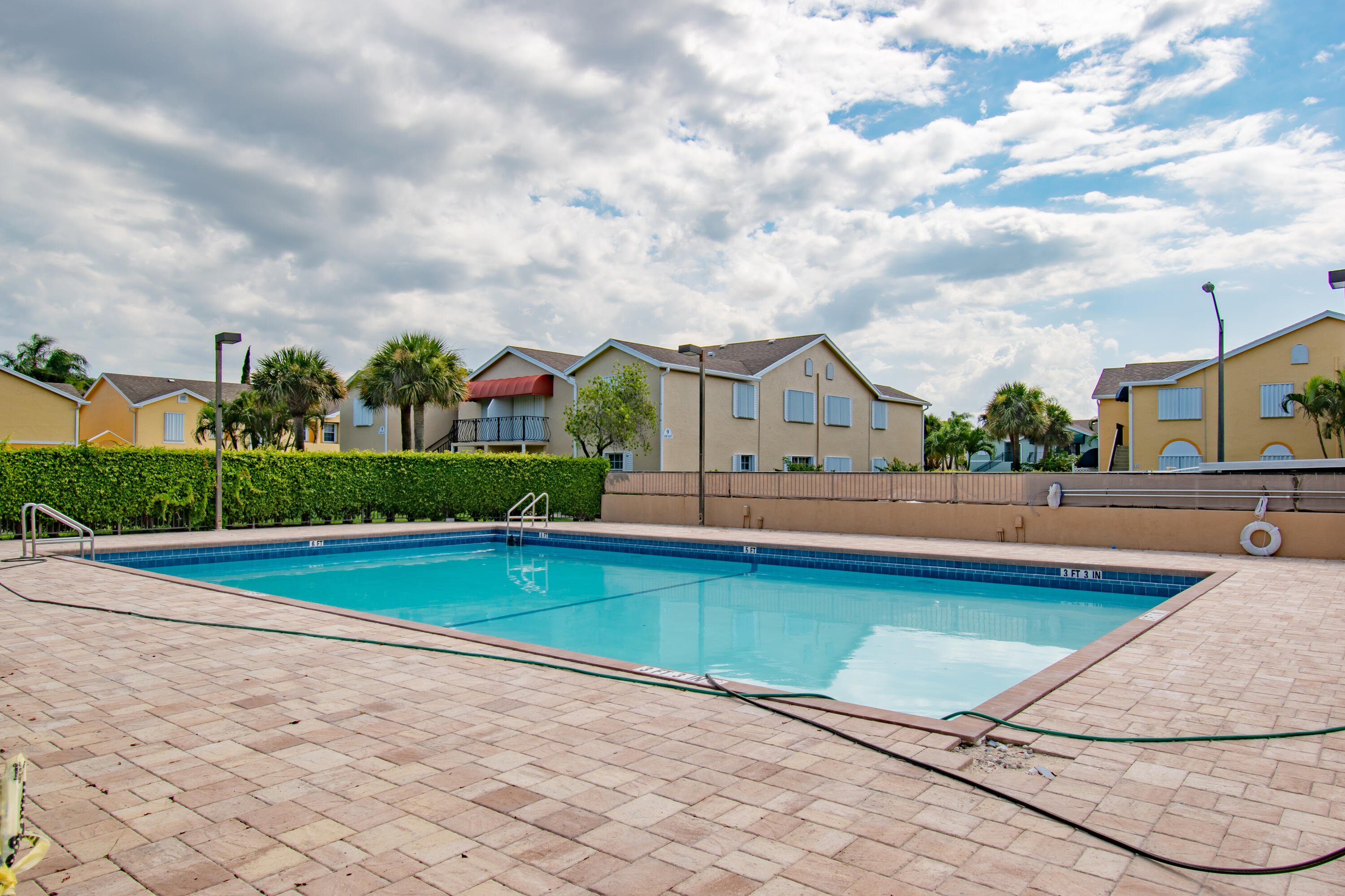 151 Waterside Drive Hypoluxo, FL 33462 - Photo 15 of 30 a view of swimming pool with a yard in front of it