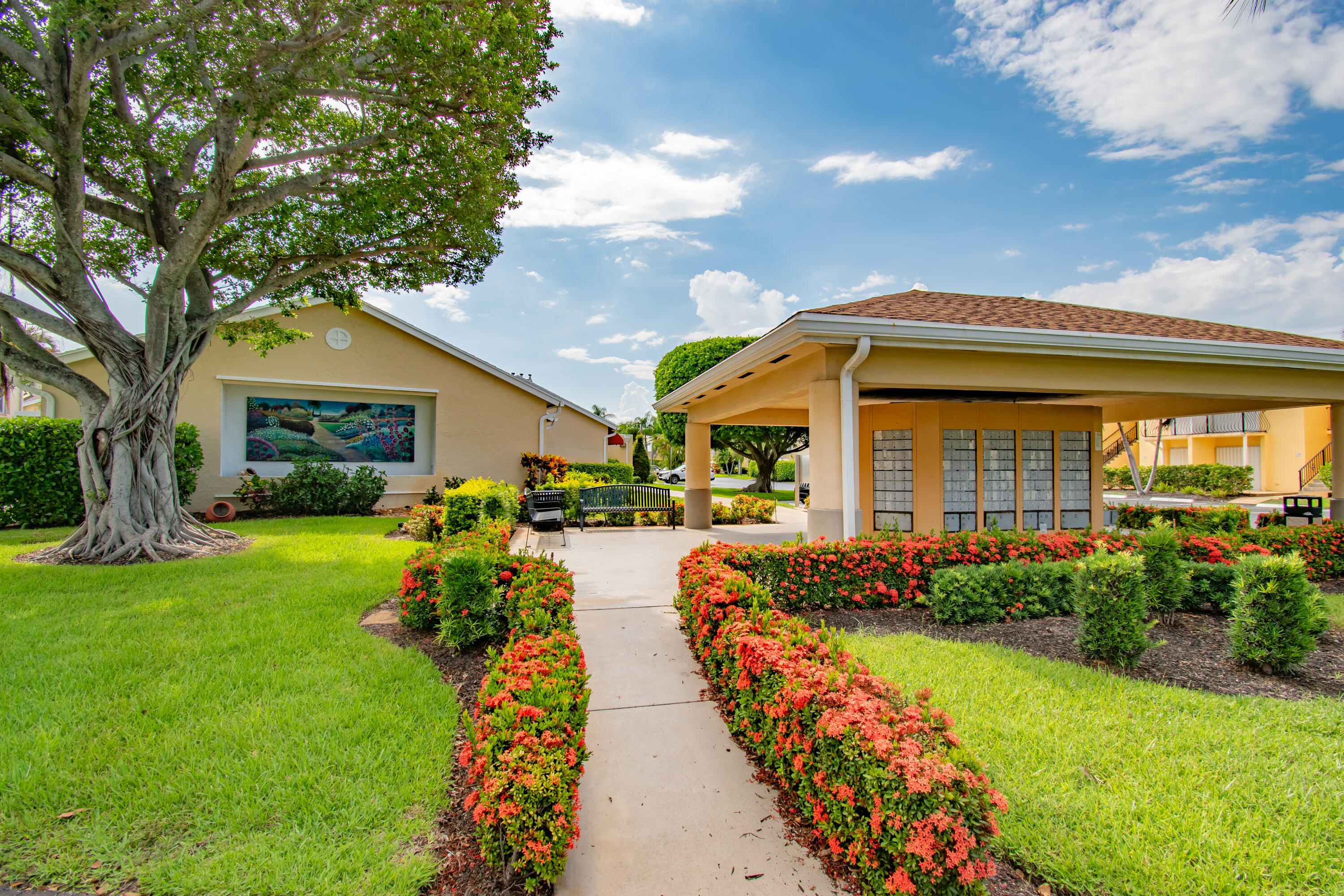 151 Waterside Drive Hypoluxo, FL 33462 - Photo 17 of 30 a front view of a house with garden