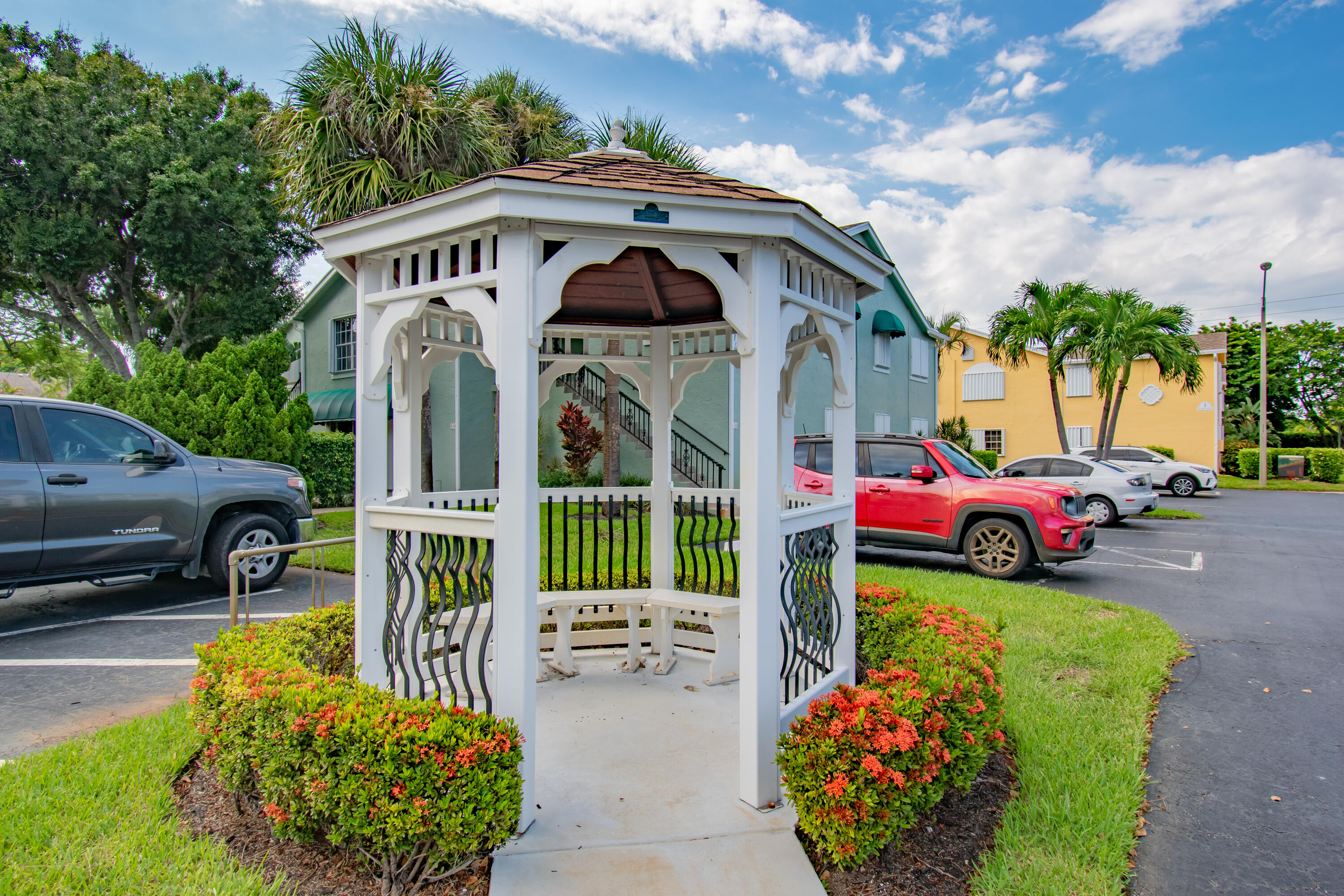 151 Waterside Drive Hypoluxo, FL 33462 - Photo 21 of 30 a front view of a house with garden