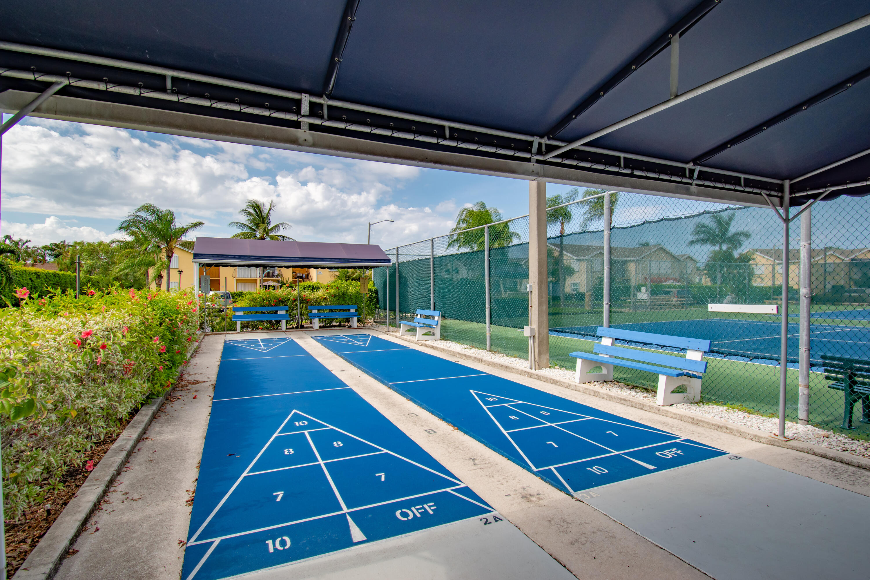 151 Waterside Drive Hypoluxo, FL 33462 - Photo 24 of 30 a view of a patio with a table and chairs