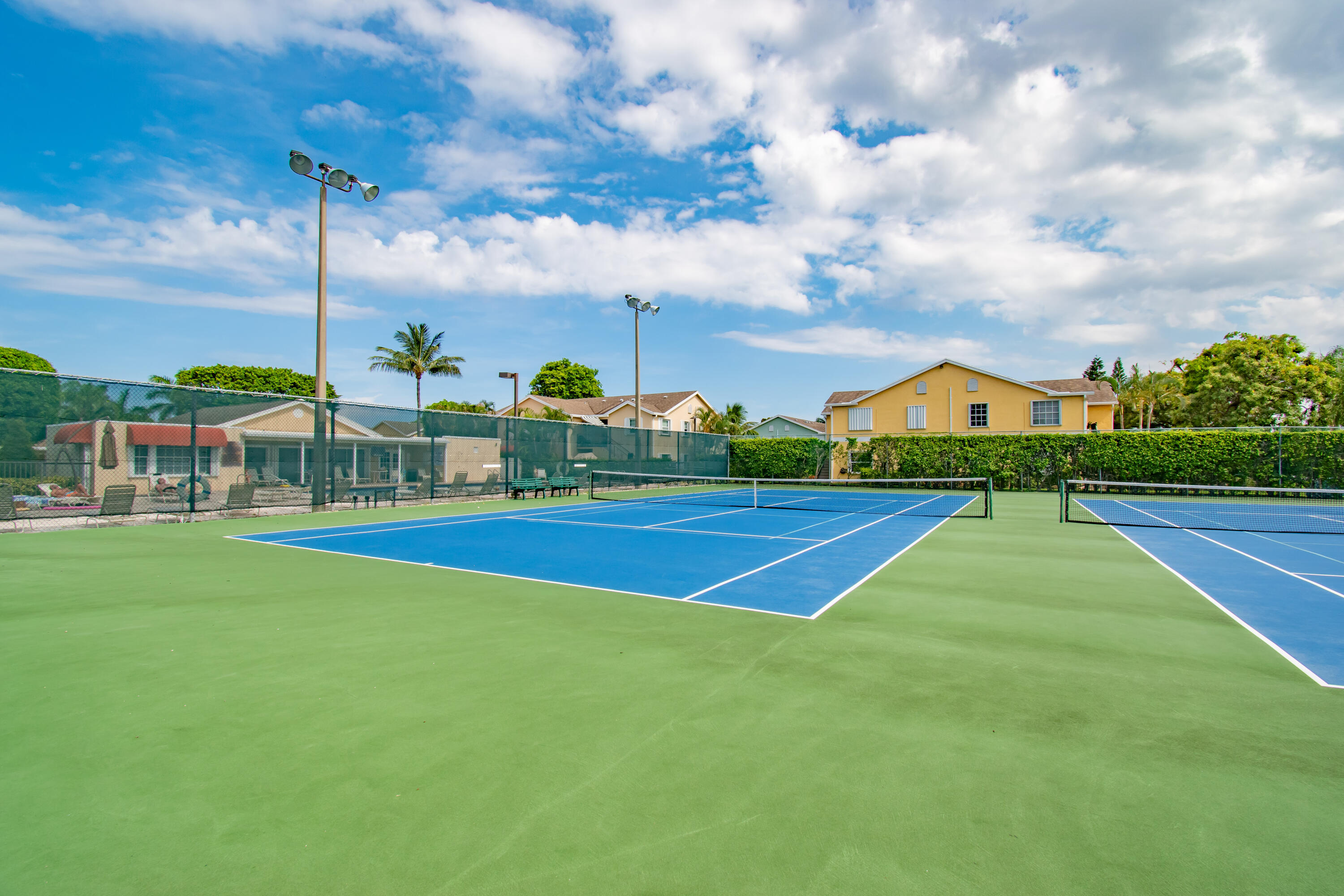 151 Waterside Drive Hypoluxo, FL 33462 - Photo 27 of 30 a view of outdoor space with swimming pool and green space