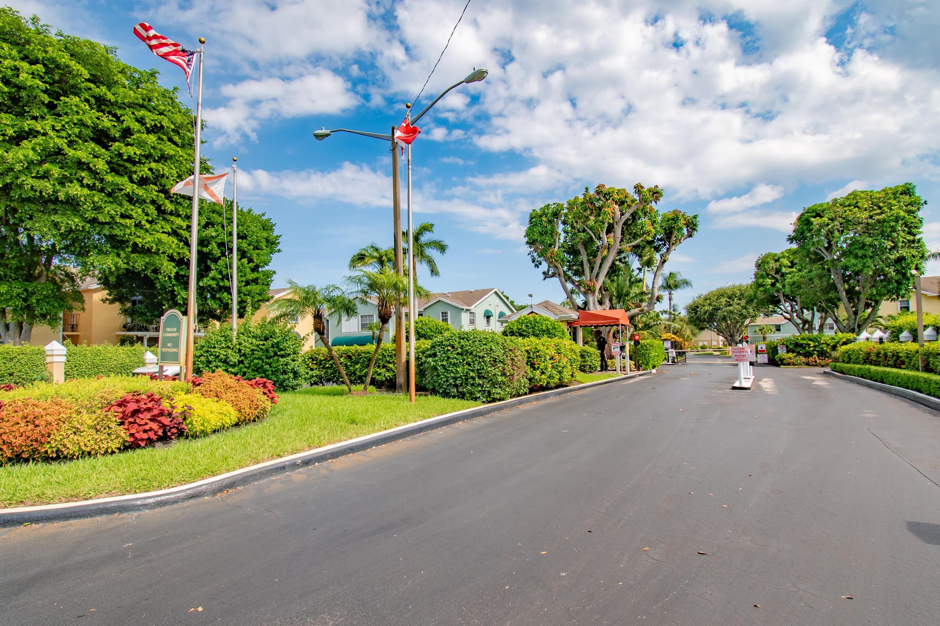151 Waterside Drive Hypoluxo, FL 33462 - Photo 28 of 30 a green field with flowers and trees