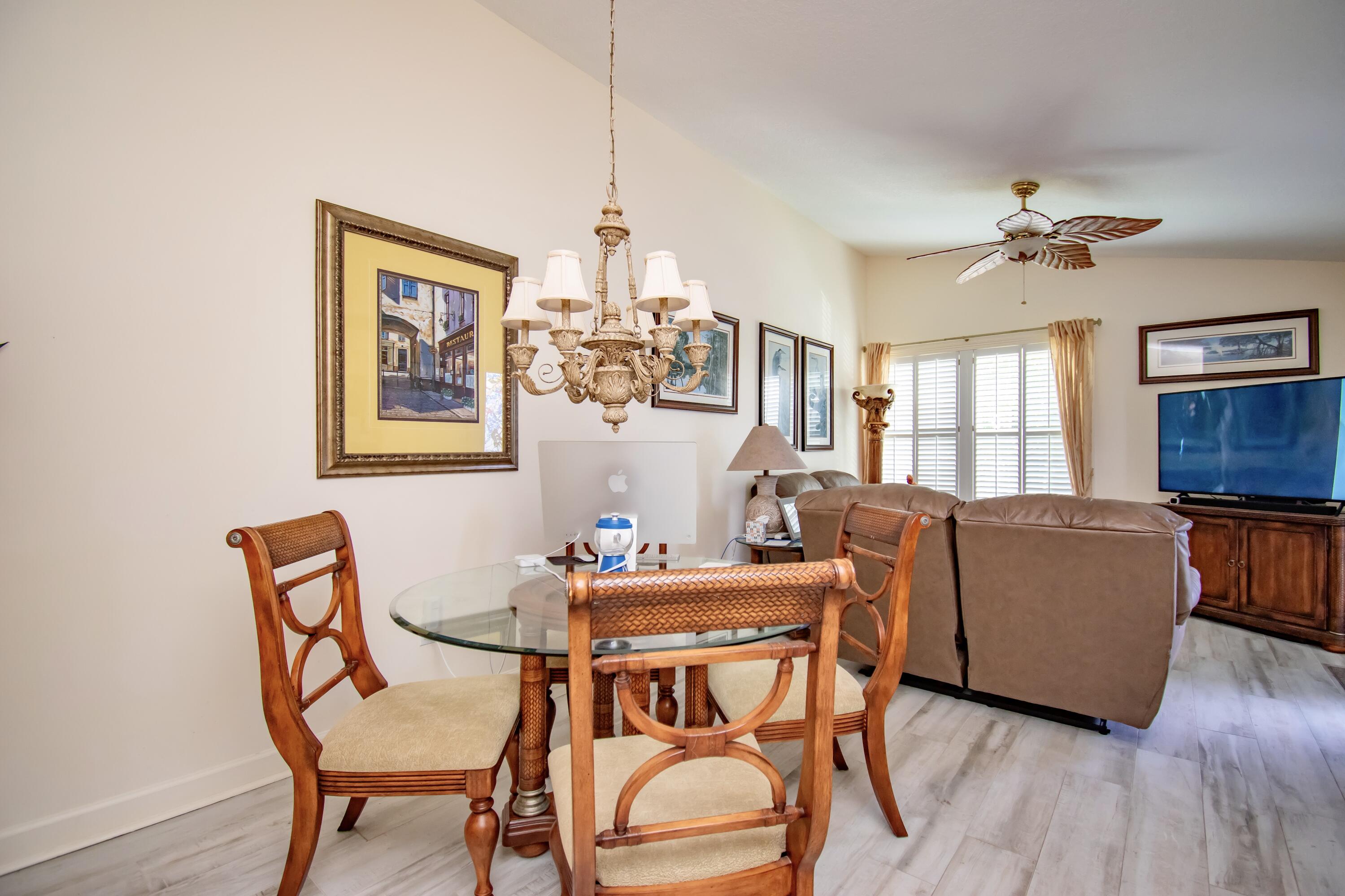 151 Waterside Drive Hypoluxo, FL 33462 - Photo 6 of 30 a dining room with furniture and window