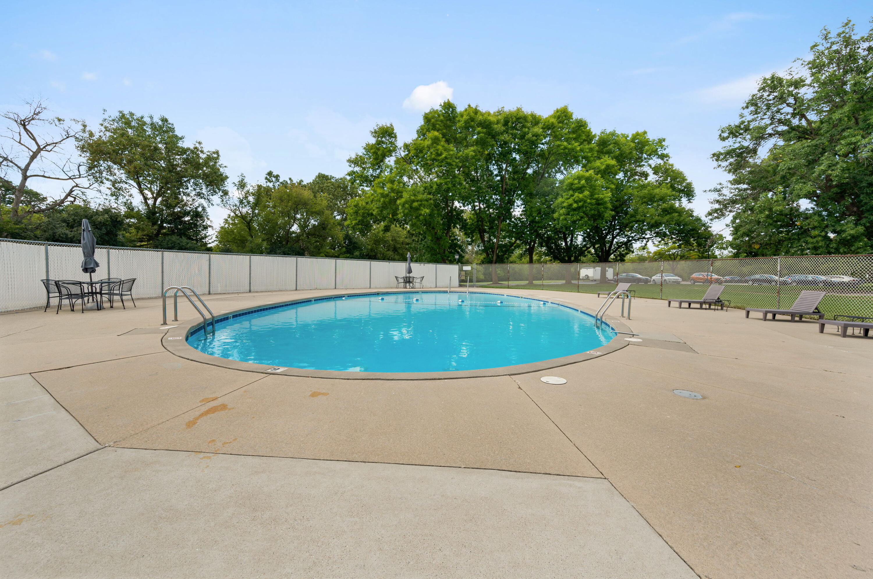 11958 West Mill Road, Unit 19 Milwaukee, WI 53225 - Photo 26 of 30 1 of 2 Outdoor Pools- steps from the condo.