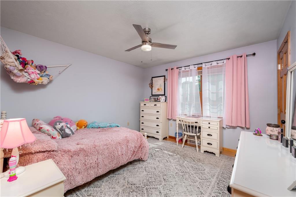 421 Protzman Road Butler, PA 16002 - Photo 20 of 30 a bedroom with a bed and a couch