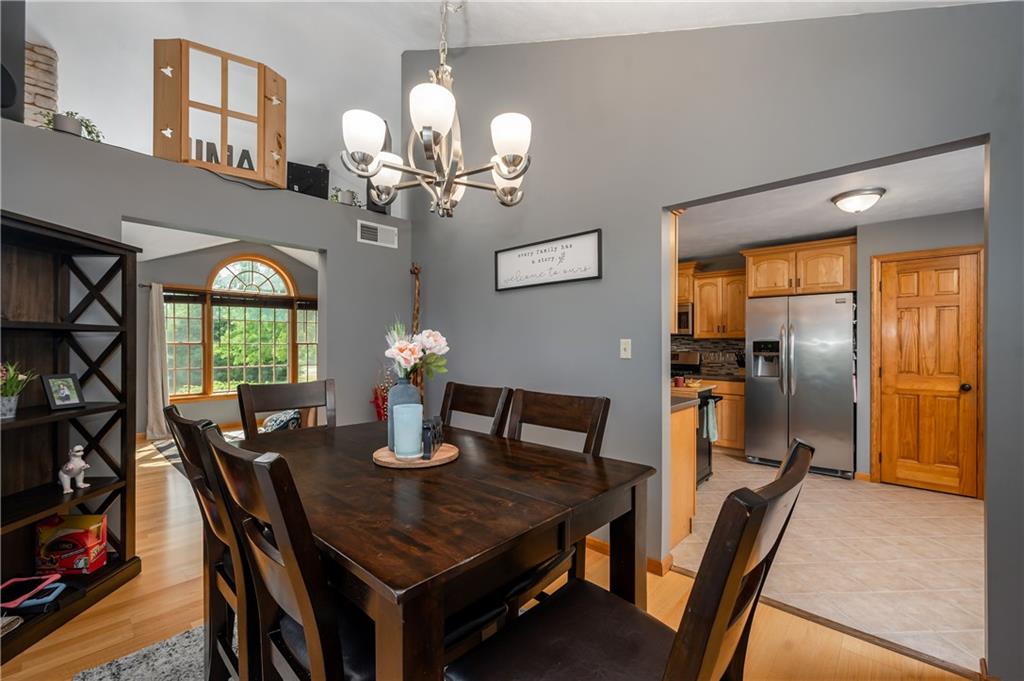 421 Protzman Road Butler, PA 16002 - Photo 8 of 30 a dining room with furniture a chandelier and window