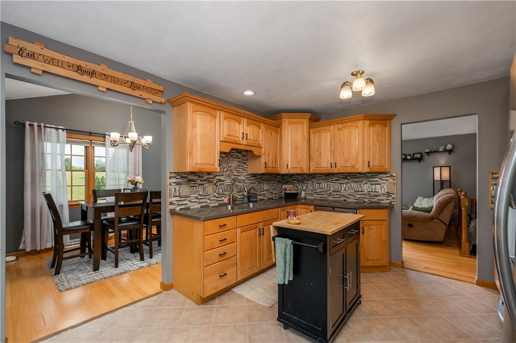 421 Protzman Road Butler, PA 16002 - Photo 10 of 30 a kitchen with stainless steel appliances granite countertop a stove and a large window