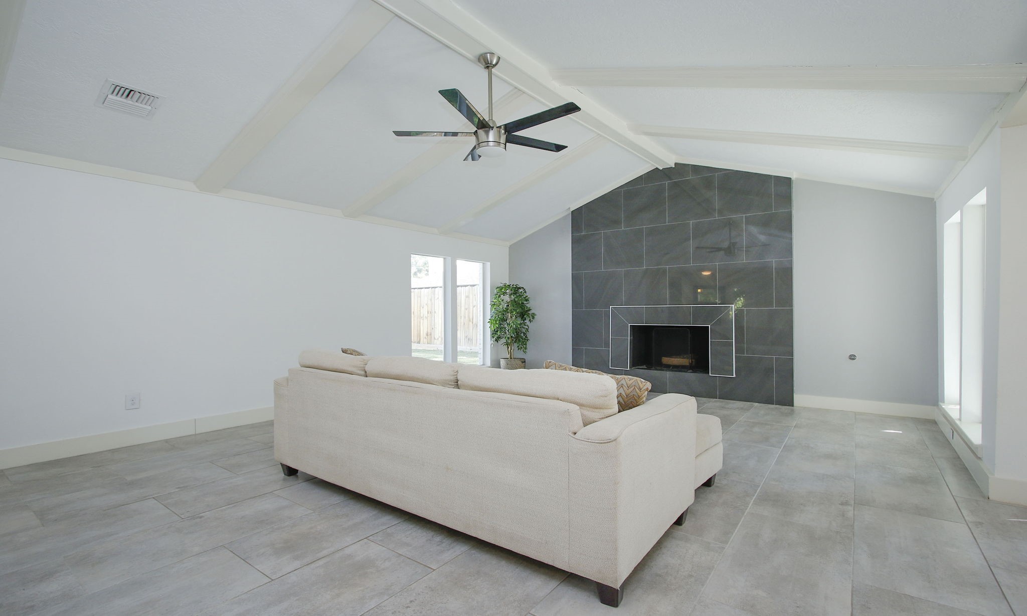 10611 Deerwood Road Houston, TX 77042 - Photo 11 of 47 a living room with furniture and a fireplace