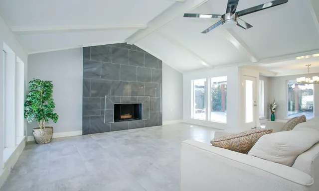 a living room with furniture white walls and white walls