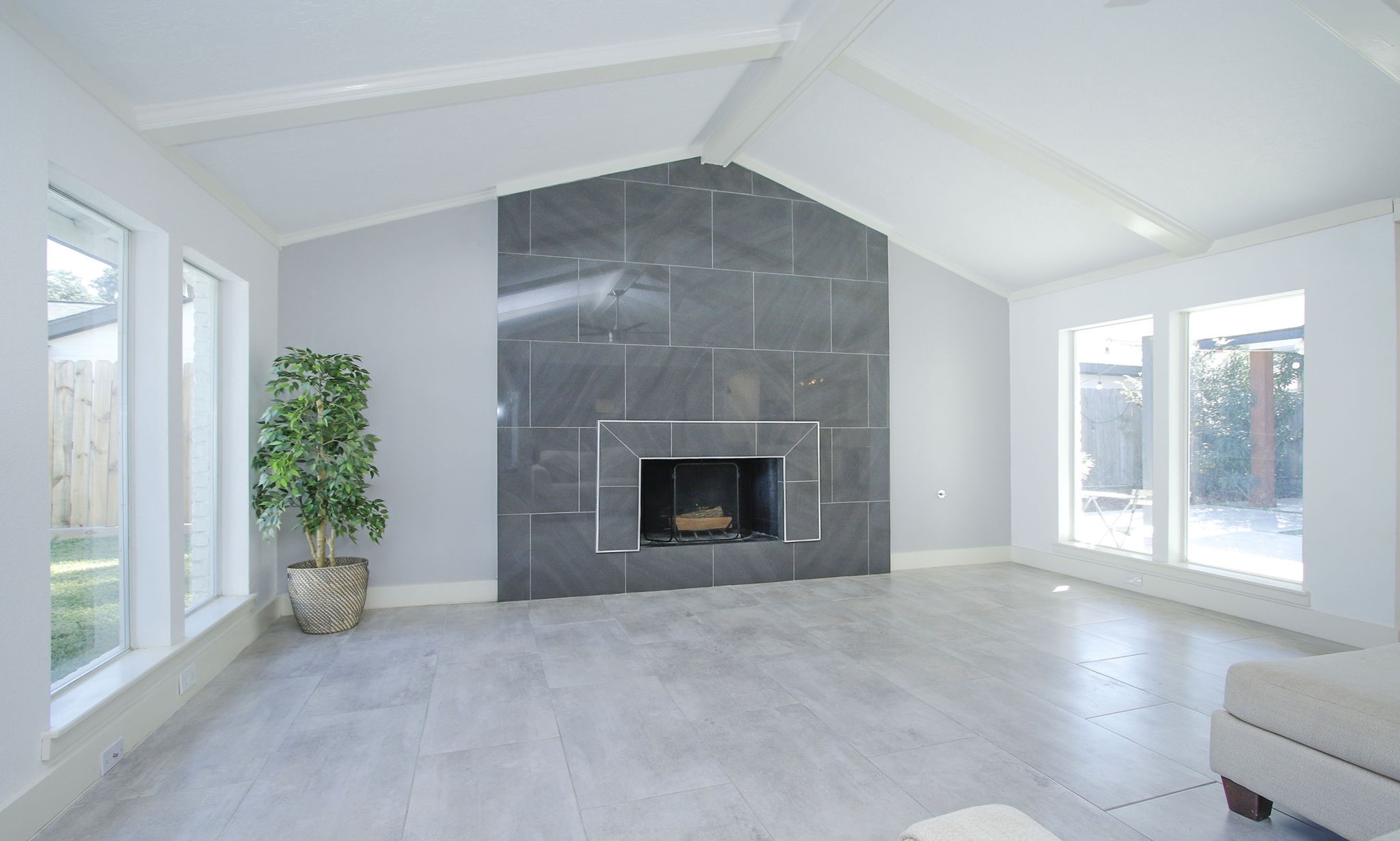 10611 Deerwood Road Houston, TX 77042 - Photo 14 of 47 a view of an empty room with a window and fire place