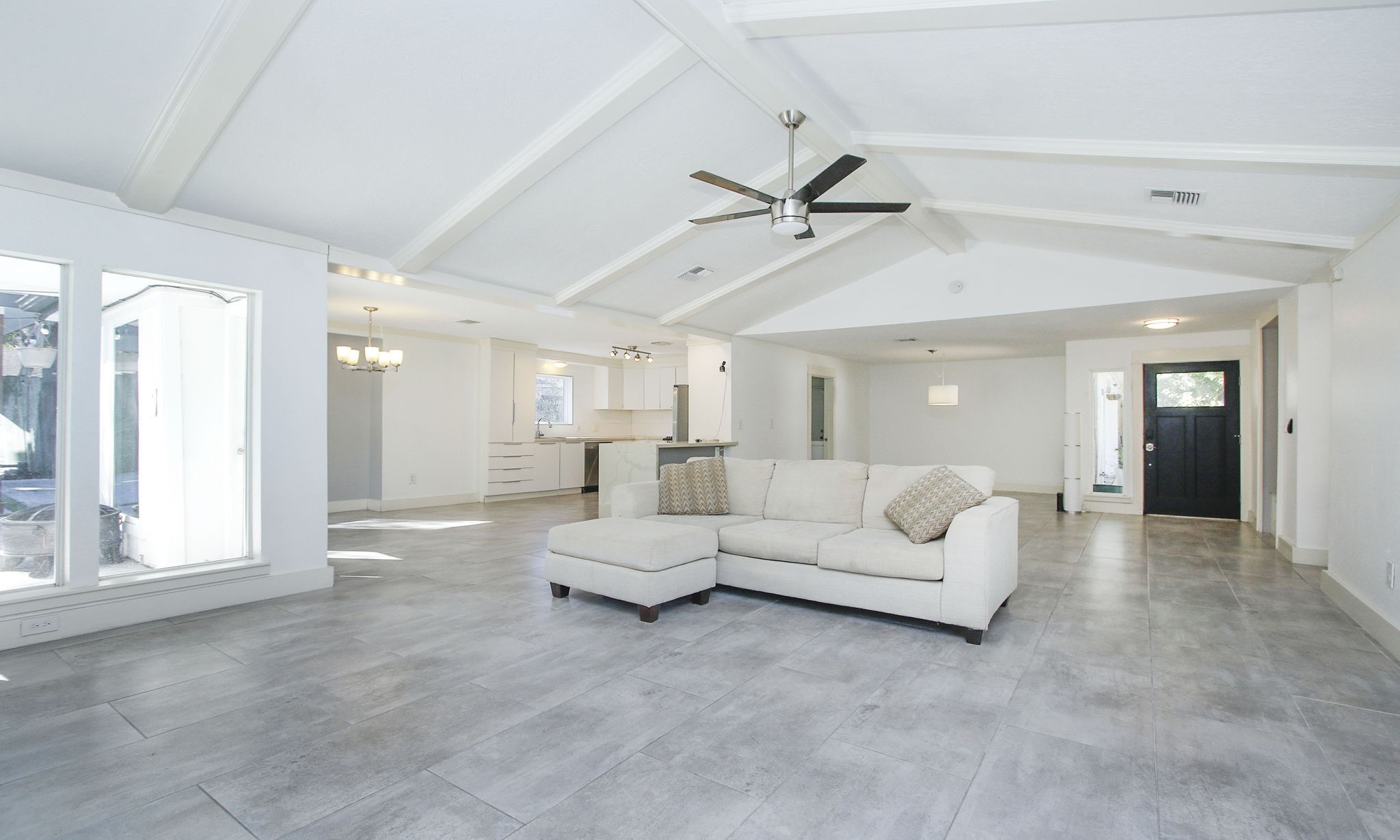 10611 Deerwood Road Houston, TX 77042 - Photo 15 of 47 a living room with furniture white walls and white walls