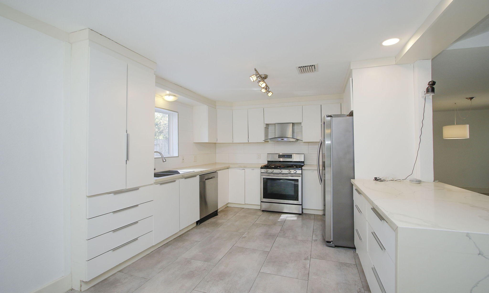 10611 Deerwood Road Houston, TX 77042 - Photo 17 of 47 a kitchen with granite countertop cabinets and steel stainless steel appliances
