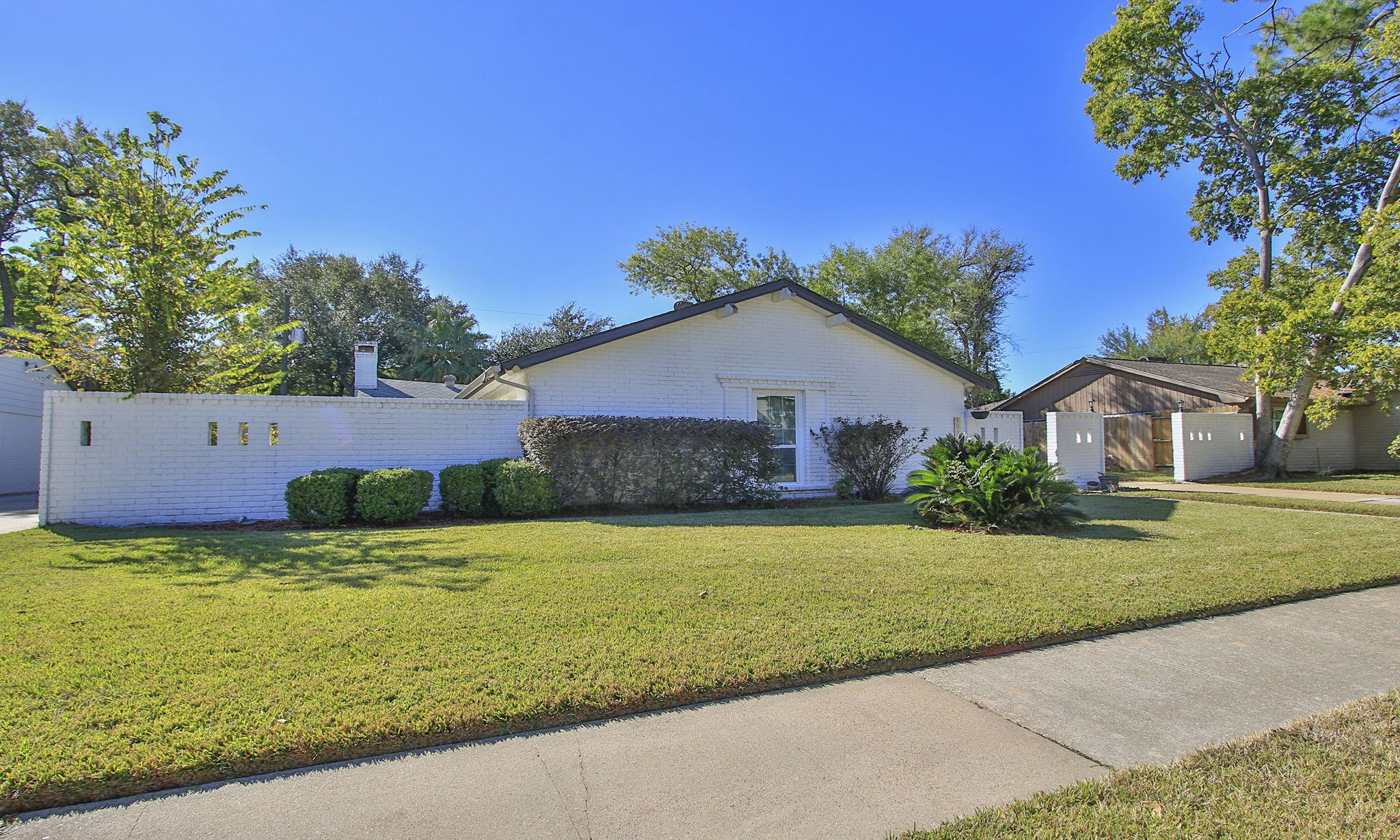 10611 Deerwood Road Houston, TX 77042 - Photo 2 of 47 a house view with a garden space