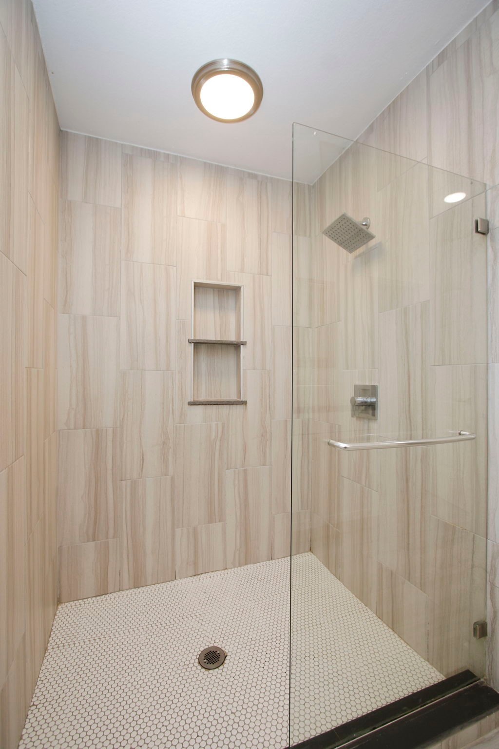 10611 Deerwood Road Houston, TX 77042 - Photo 24 of 47 a bathroom with a shower and a tub