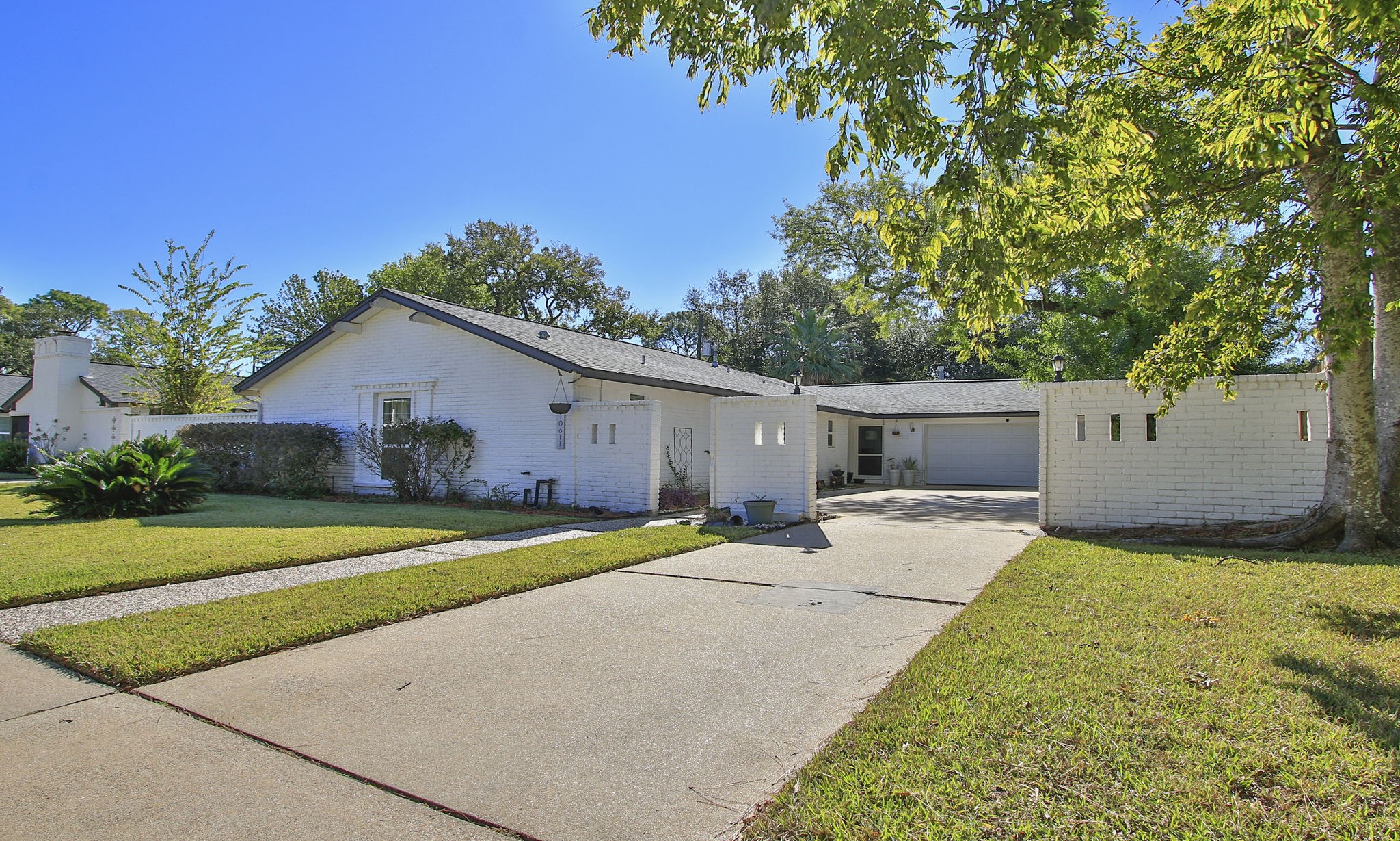 10611 Deerwood Road Houston, TX 77042 - Photo 3 of 47 a house view with a backyard space
