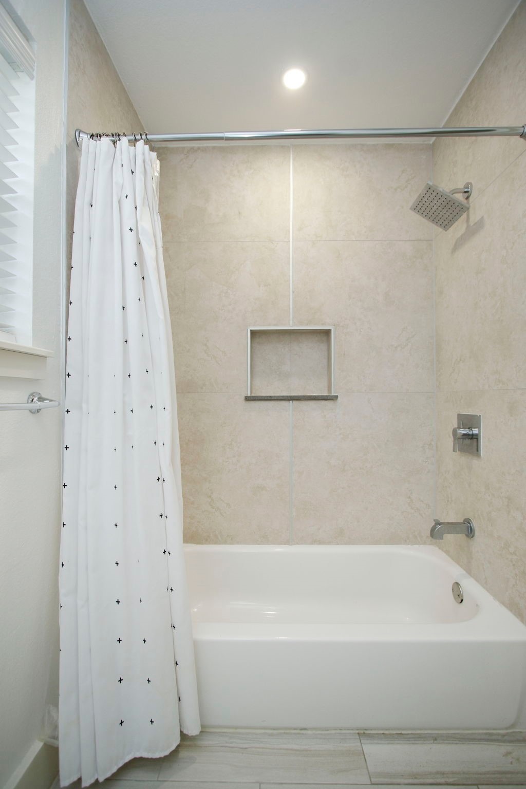 10611 Deerwood Road Houston, TX 77042 - Photo 34 of 47 a bathroom with a shower curtain and a bathtub