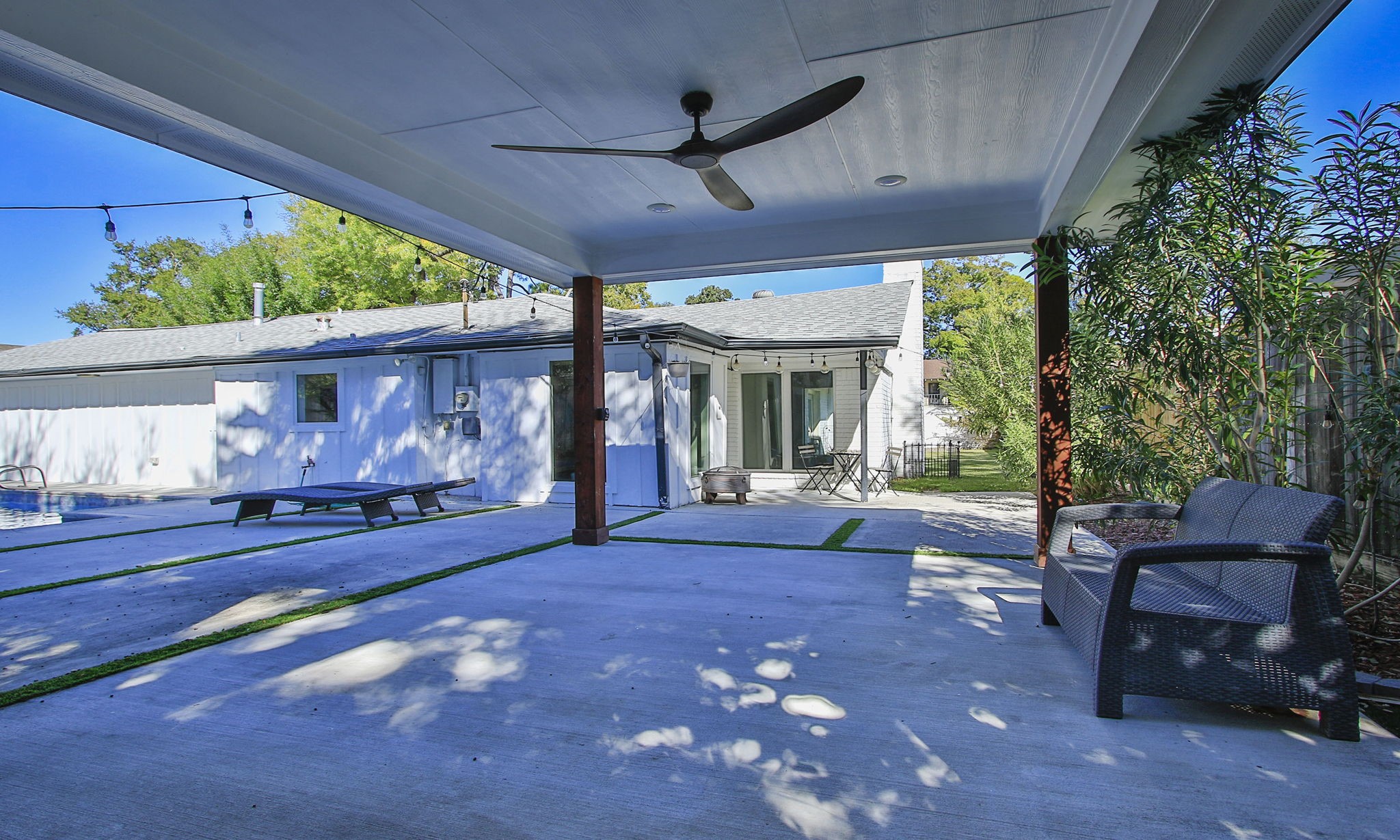 10611 Deerwood Road Houston, TX 77042 - Photo 39 of 47 a view of a porch with furniture and floor to ceiling window