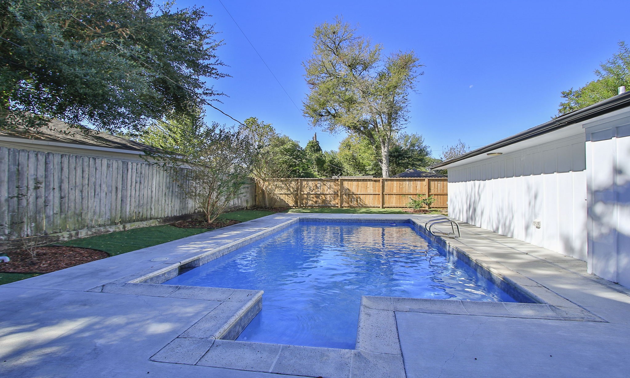 10611 Deerwood Road Houston, TX 77042 - Photo 41 of 47 a view of outdoor space with pool and wooden fence