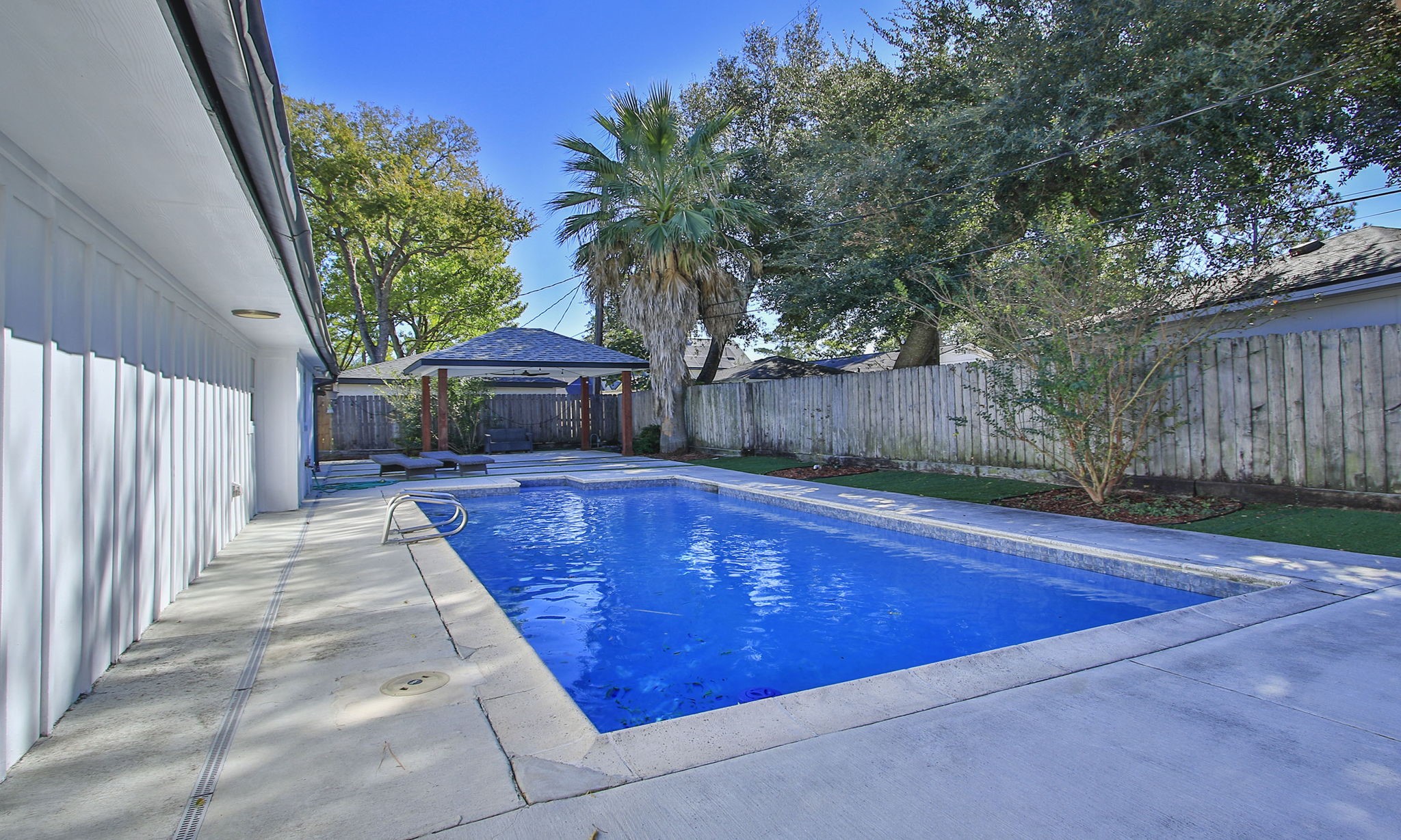 10611 Deerwood Road Houston, TX 77042 - Photo 43 of 47 a view of a house with a swimming pool