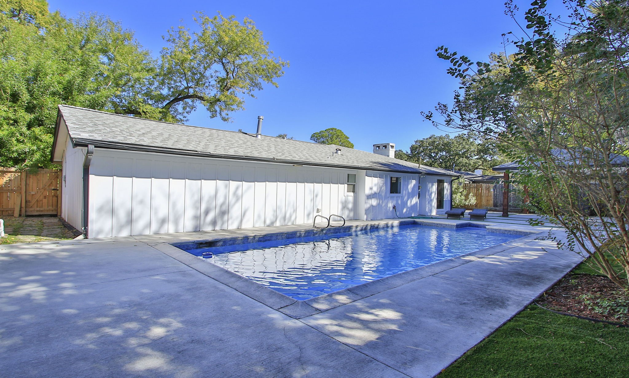 10611 Deerwood Road Houston, TX 77042 - Photo 44 of 47 a view of a backyard with a patio
