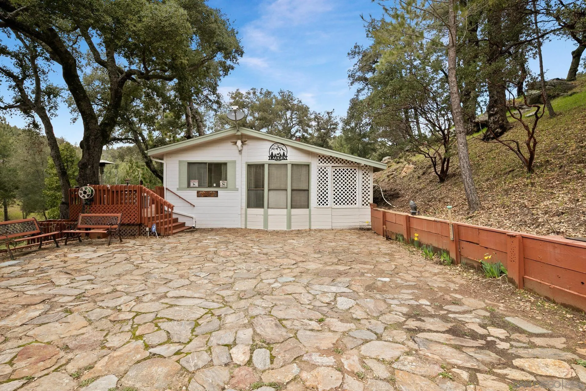 5820 Boulder Creek Road Julian, CA 92036 - Photo 32 of 75 a house with trees in the background