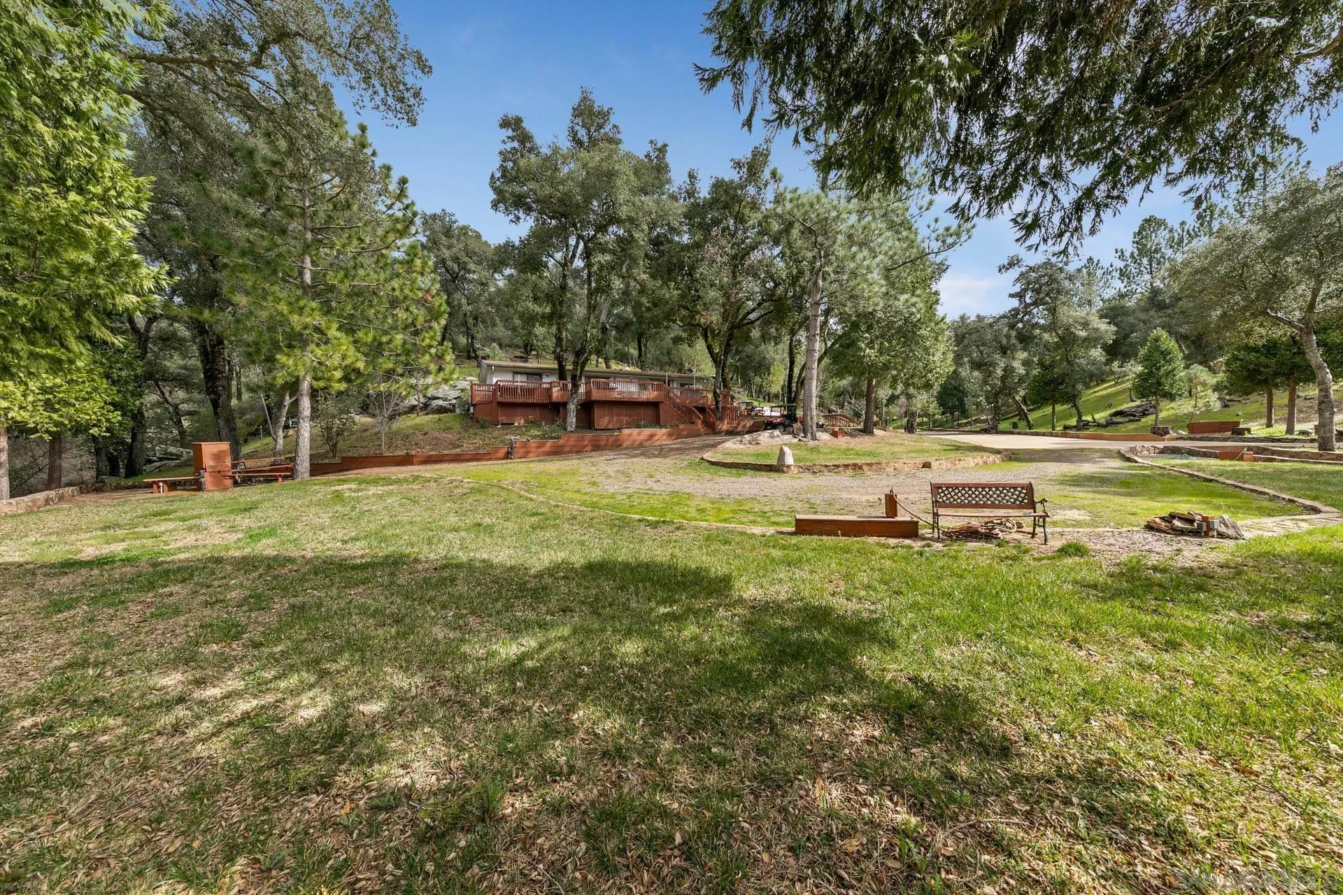 5820 Boulder Creek Road Julian, CA 92036 - Photo 38 of 75 a backyard of a house with table and chairs