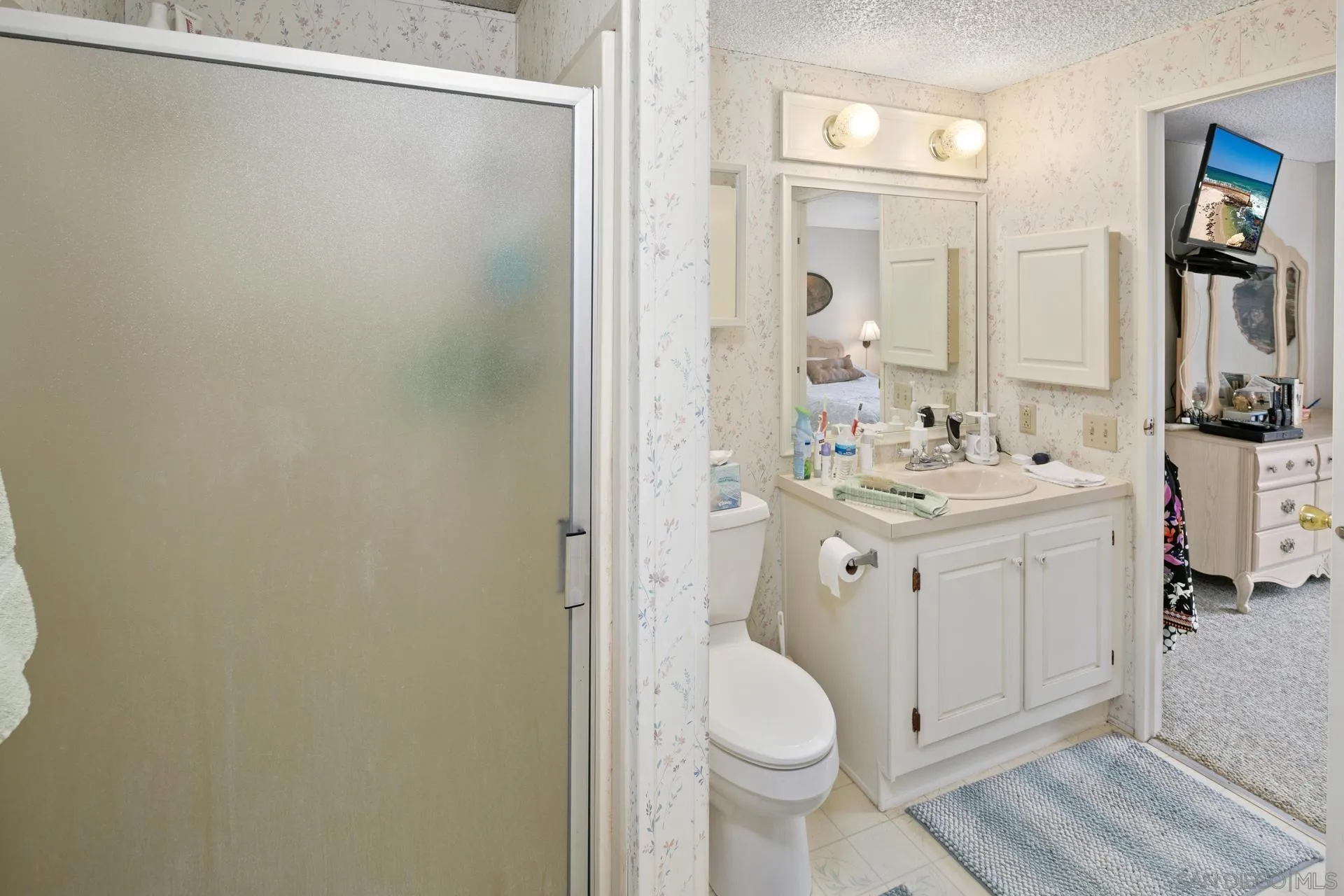 5820 Boulder Creek Road Julian, CA 92036 - Photo 55 of 75 a bathroom with a sink a toilet and a mirror