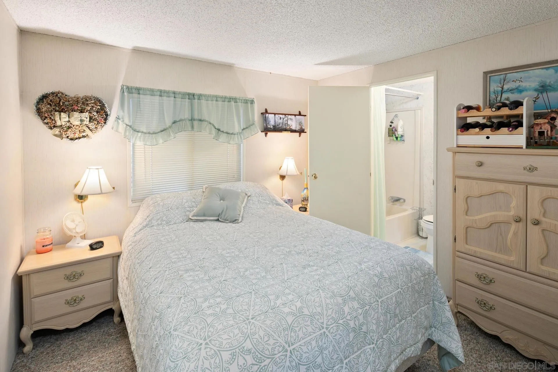 5820 Boulder Creek Road Julian, CA 92036 - Photo 56 of 75 a bedroom with a bed and a cabinets