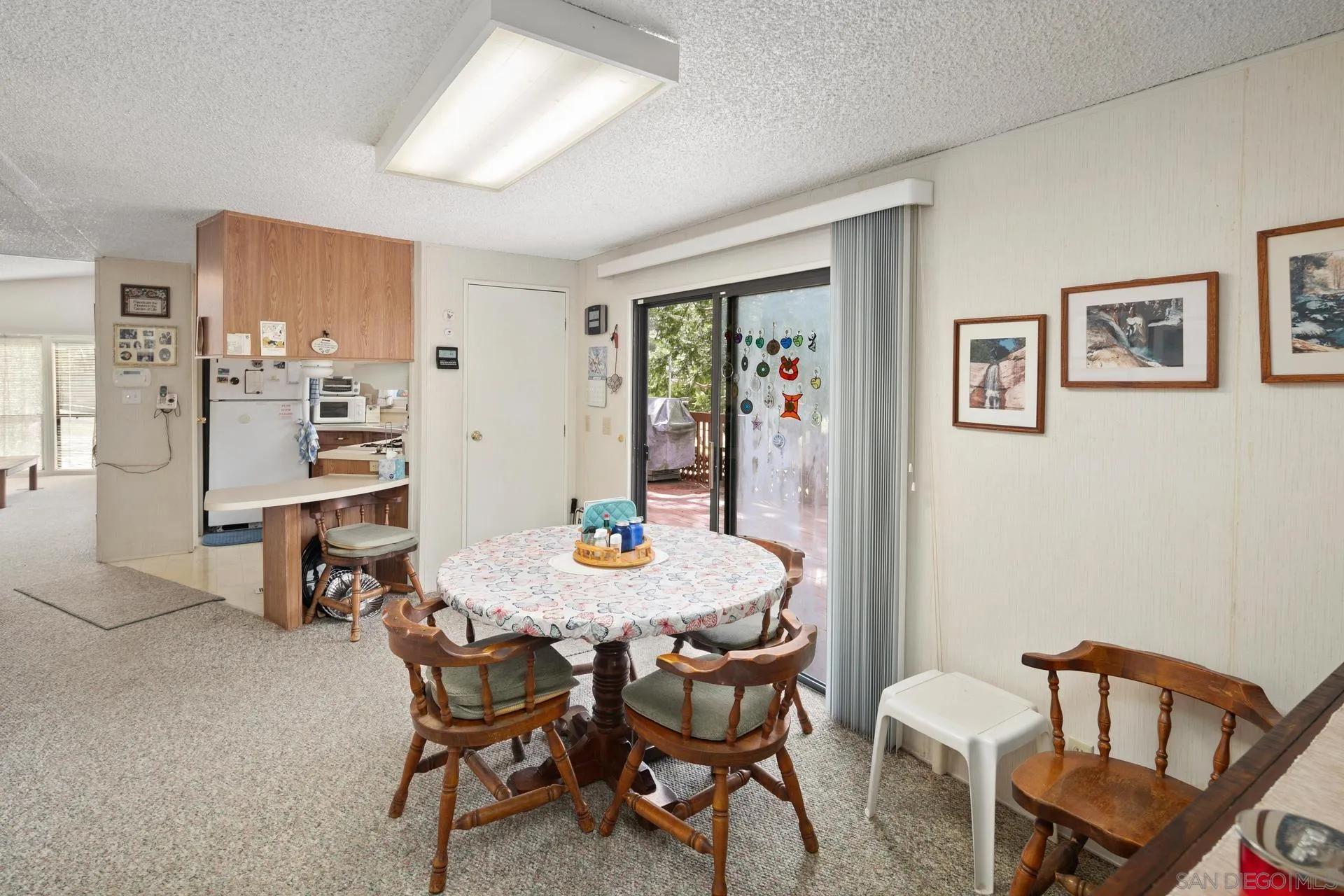 5820 Boulder Creek Road Julian, CA 92036 - Photo 58 of 75 a view of a dining room with furniture and a window