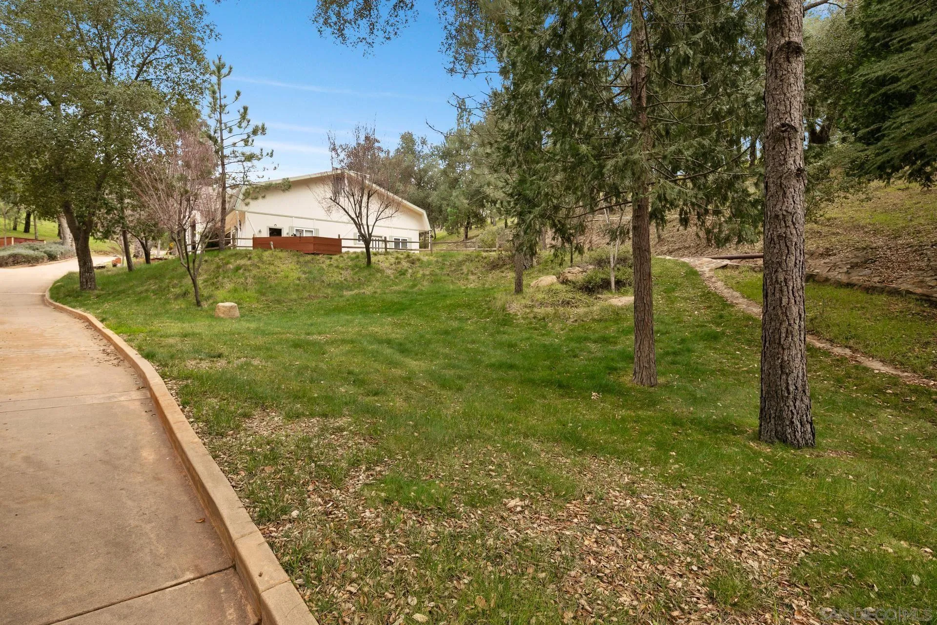 5820 Boulder Creek Road Julian, CA 92036 - Photo 68 of 75 a view of a garden with a bench