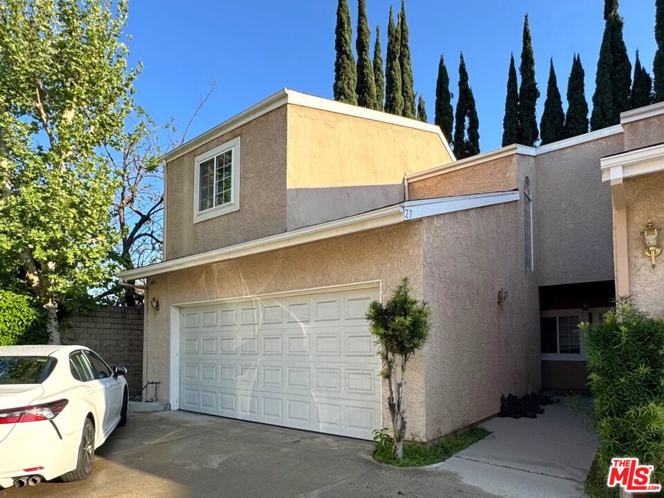 19928 Chase Street, Unit 27 Winnetka, CA 91306 - Photo 1 of 18 a view of a house with a backyard