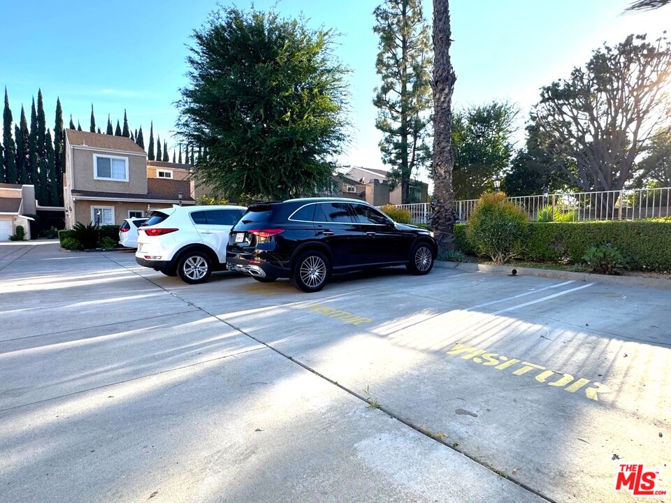 19928 Chase Street, Unit 27 Winnetka, CA 91306 - Photo 18 of 18 a view of street with parked cars