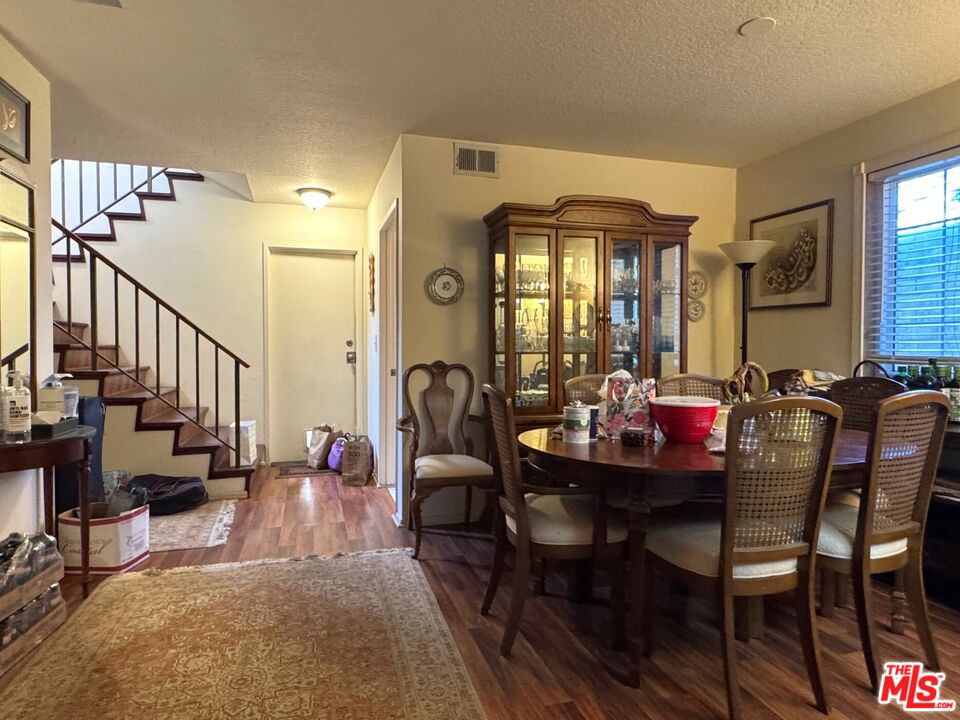 19928 Chase Street, Unit 27 Winnetka, CA 91306 - Photo 4 of 18 a view of a dining room with furniture