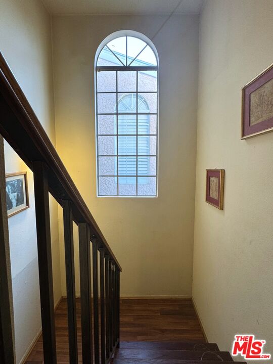 19928 Chase Street, Unit 27 Winnetka, CA 91306 - Photo 8 of 18 a view of entryway with wooden floor and stairs