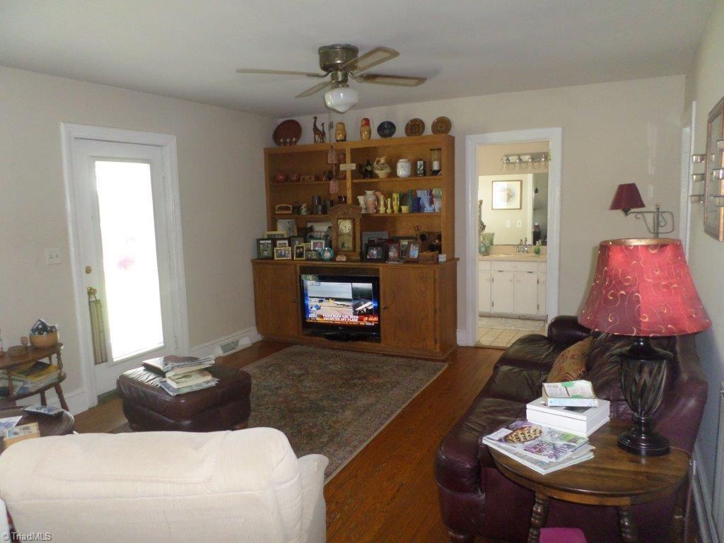 163 Manley Farm Road Reidsville, NC 27320 - Photo 26 of 30 den with access to covered side porch