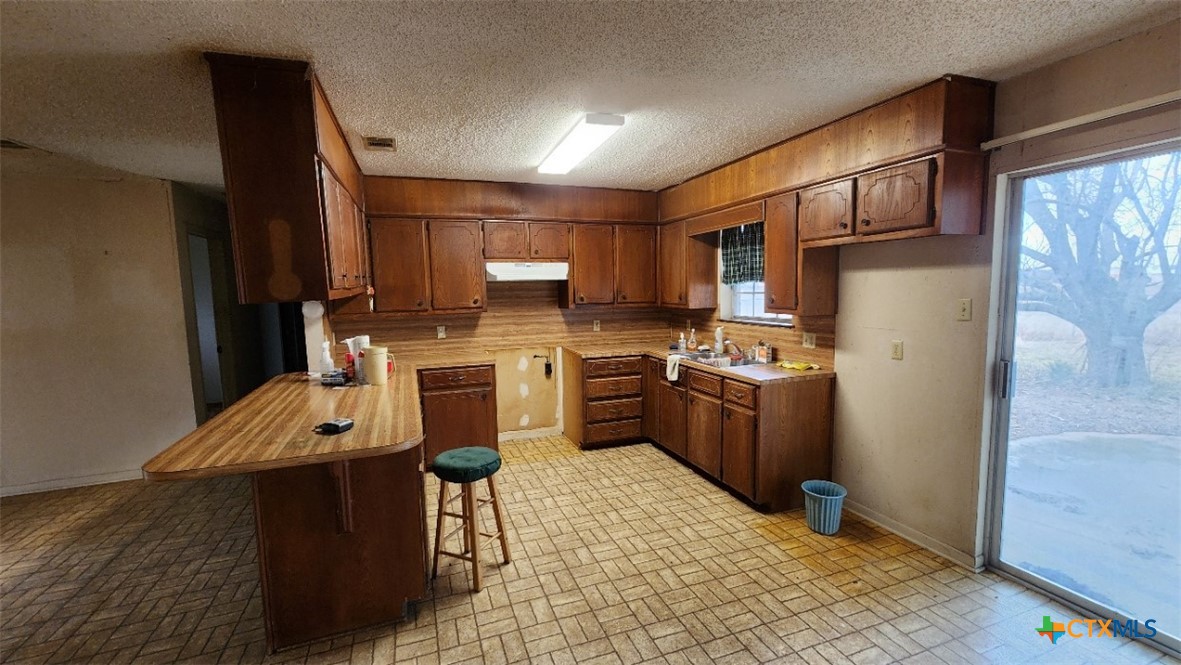 2002 Airville Road Temple, TX 76501 - Photo 15 of 41 a kitchen with a sink appliances and cabinets
