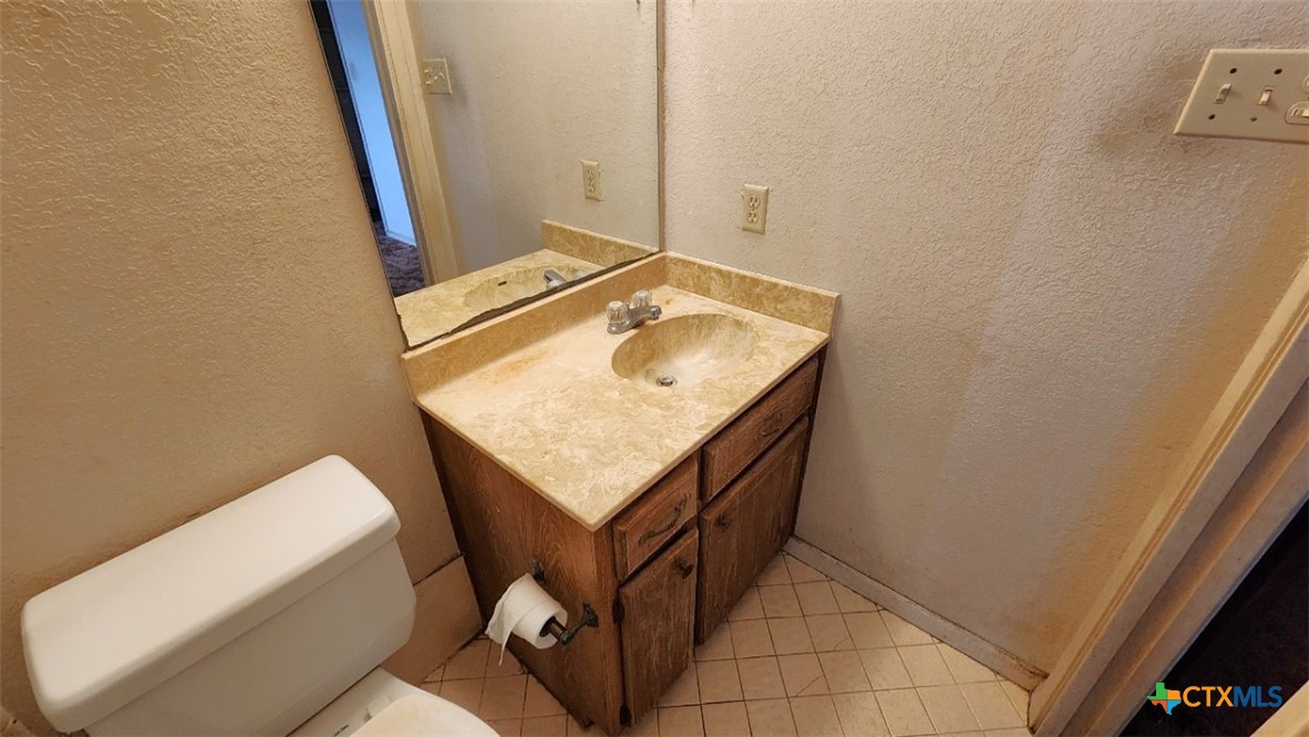 2002 Airville Road Temple, TX 76501 - Photo 25 of 41 a bathroom with a sink toilet and mirror