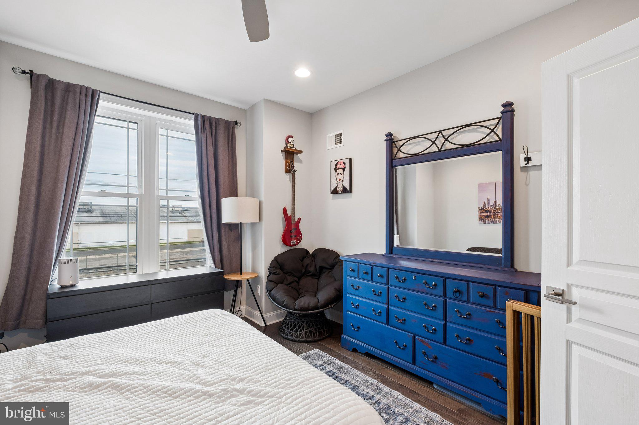 3356 Agate Street Philadelphia, PA 19134 - Photo 20 of 31 a bedroom with a bed window and mirror