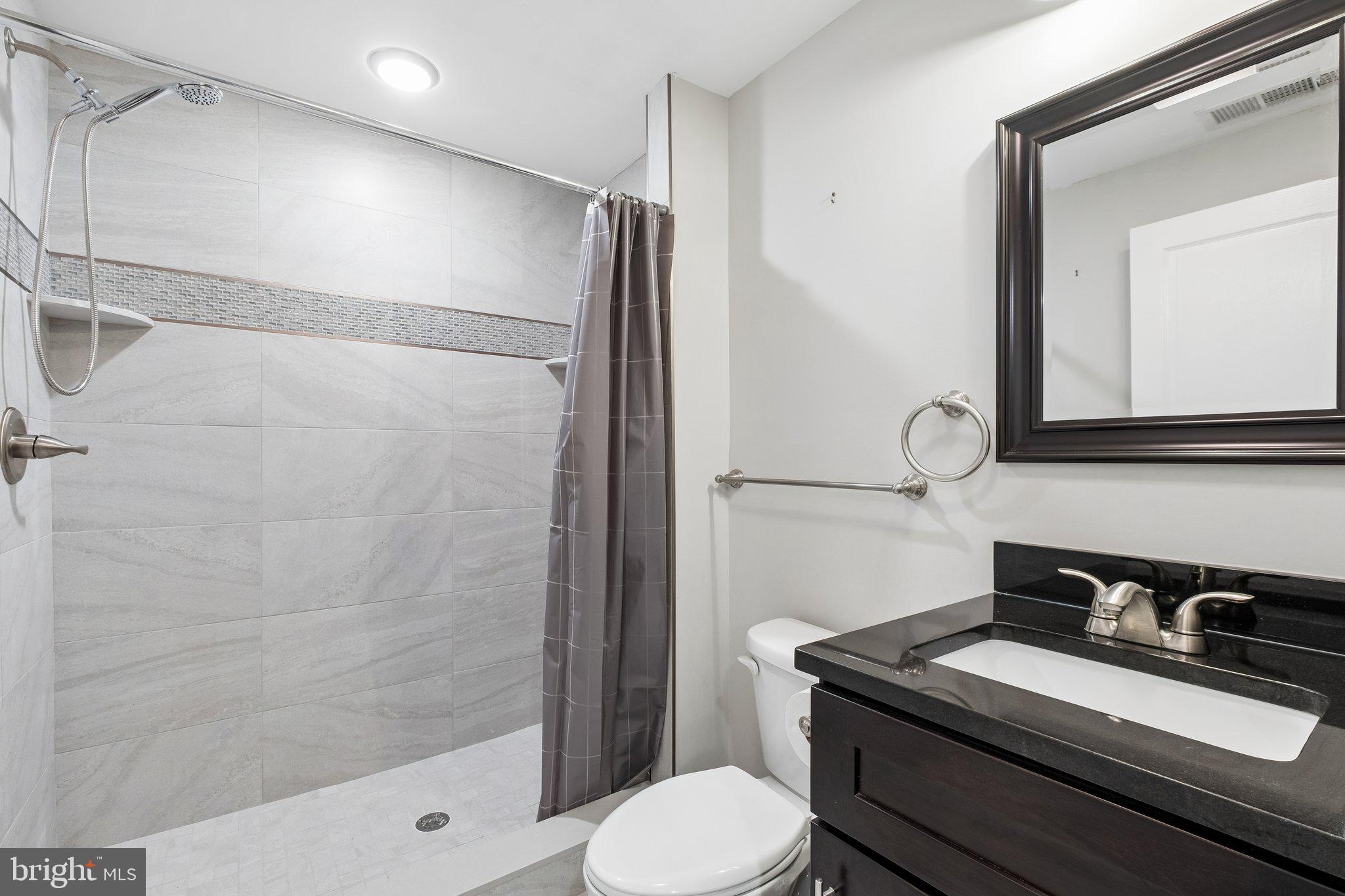 3356 Agate Street Philadelphia, PA 19134 - Photo 22 of 31 a bathroom with a sink toilet and shower