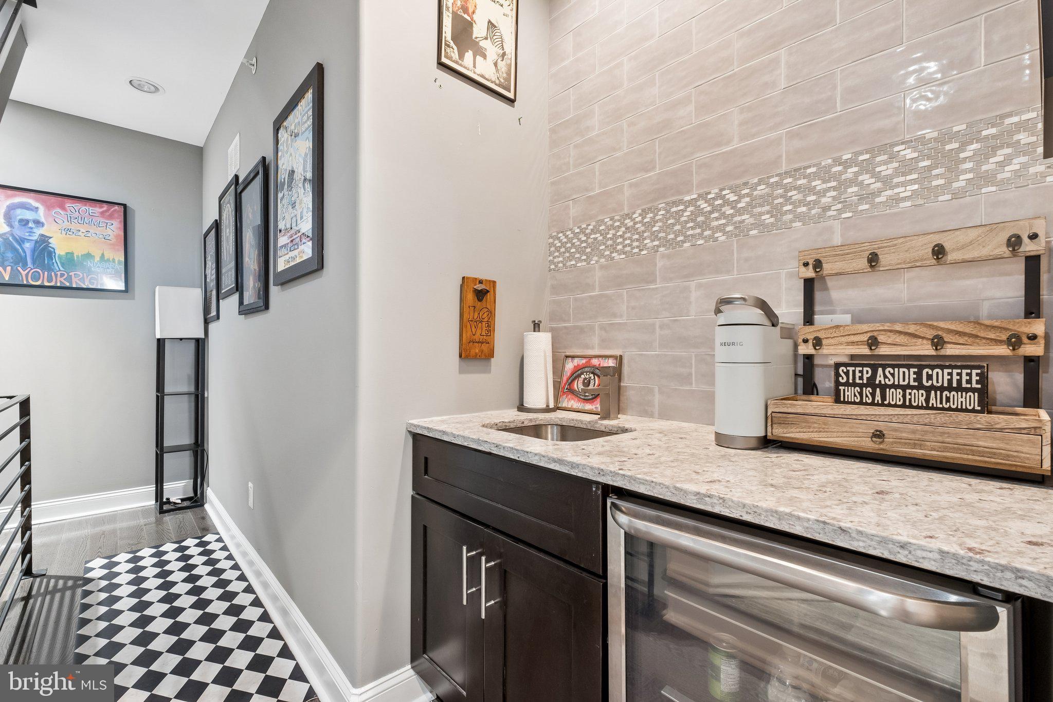 3356 Agate Street Philadelphia, PA 19134 - Photo 23 of 31 a hallway with granite countertop a stove and a sink