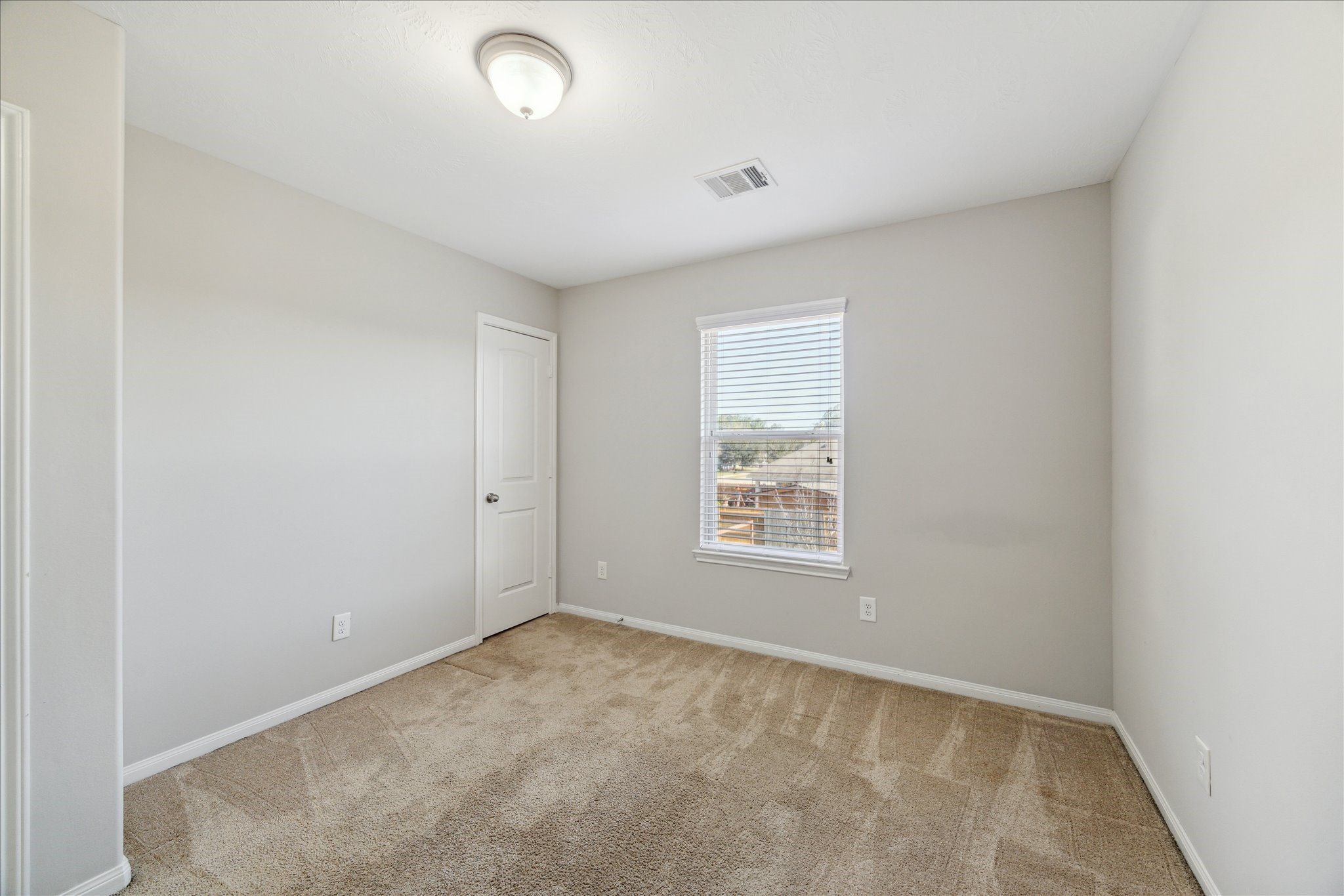 5710 Mid Way Kingwood, TX 77339 - Photo 11 of 15 an empty room with a window